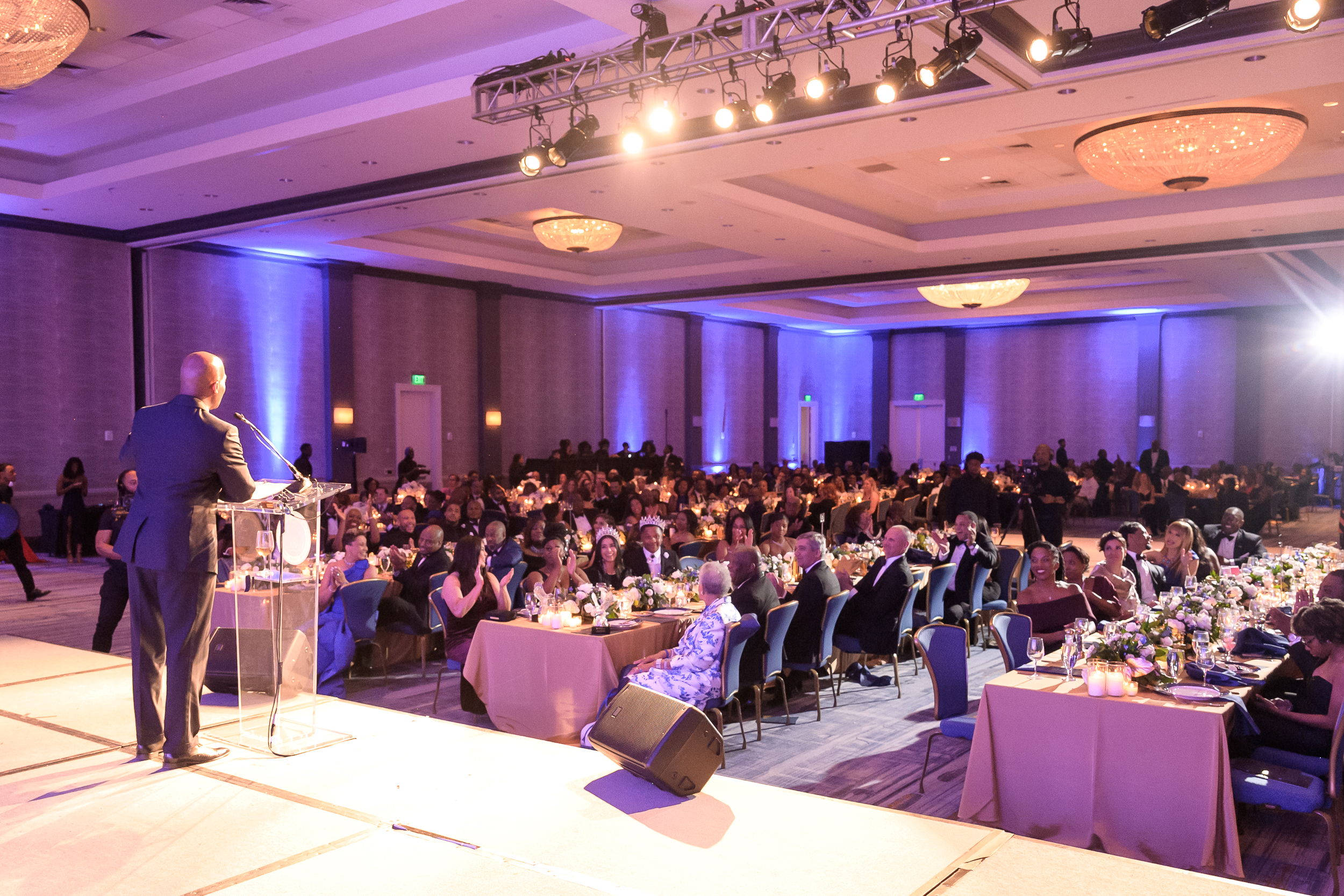 Gala room wide shot president jenkins on stage