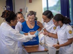 medical students with medical dummy