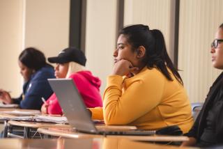 student with computer